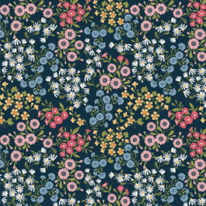 Poppie Cotton Sprays of flowers on a navy blue fabric background