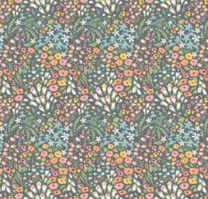 Poppie Cotton Hollyhock Lane floral design on a grey fabric background