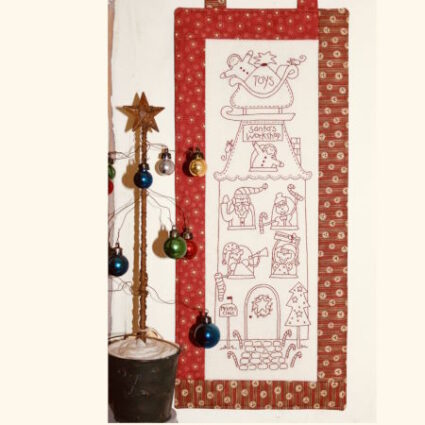 Santas Workshop wallhanging pattern designed by Natalie Bird from The Birdhouse.